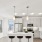 Model kitchen at The Holston apartments for rent in Fort Worth, TX, featuring wood grain flooring and a kitchen island.