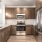 View of a luxury kitchen with dark wood cabinetry and stainless steel features in an apartment for rent in Fort Worth TX.
