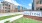 The entrance to the Holston apartments in North Fort Worth, featuring a large sign and a view of the apartments.