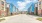 Wide street running on the grounds of The Holston in North Fort Worth, TX, featuring a view of the colorful apartments.