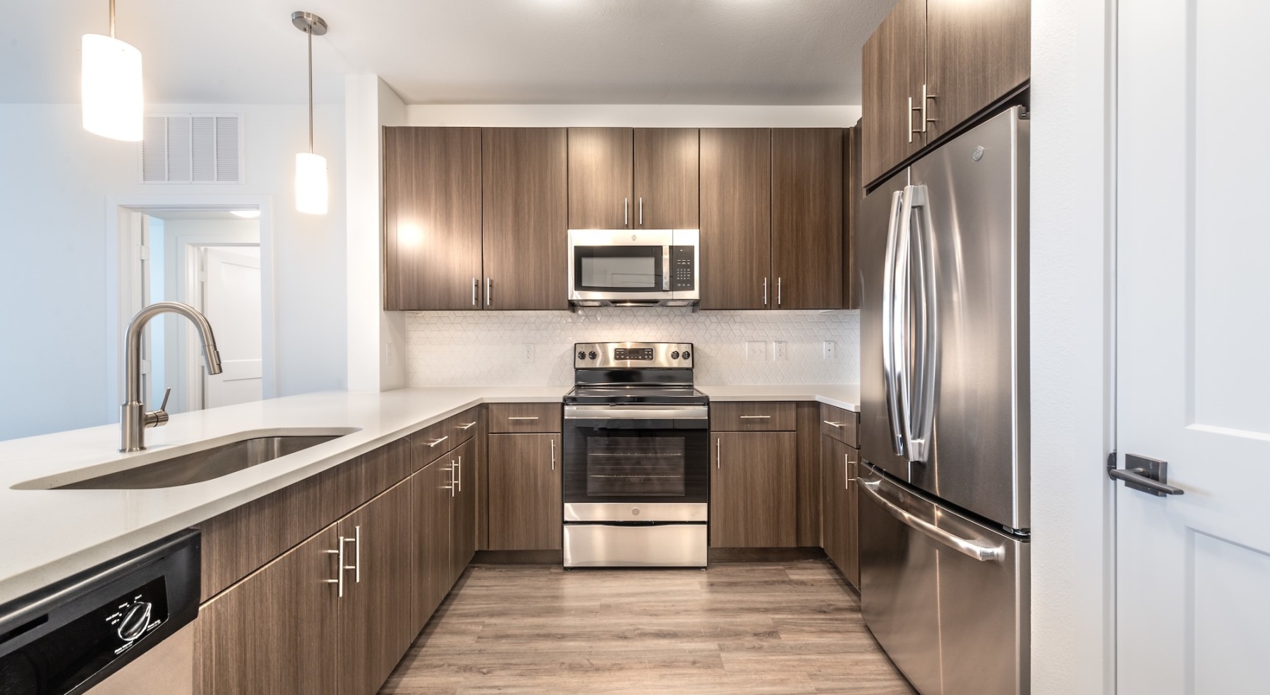 kitchen with brown cabinets and stainless steel appliances